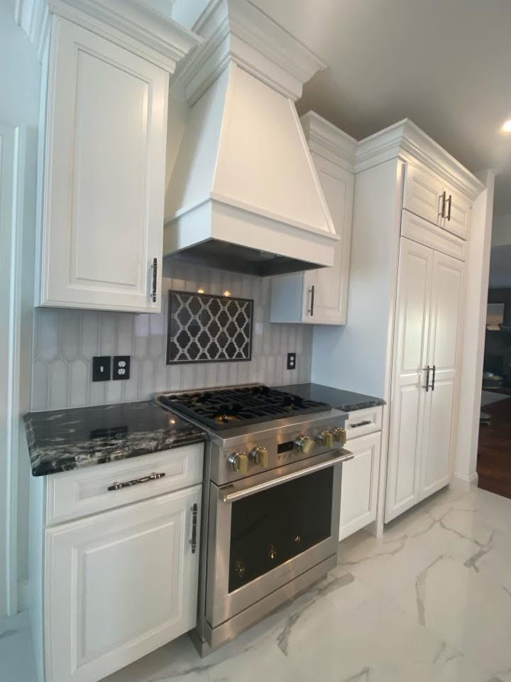 Traditional white kitchen with range